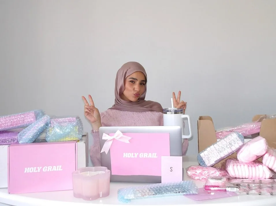 Sara with beauty products and branding